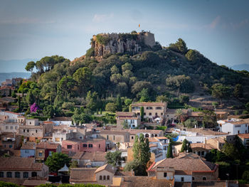 Buildings in town against sky