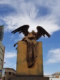 Low angle view of statue against sky