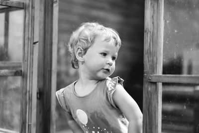 Portrait of cute boy standing outdoors