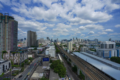 High angle view of street amidst buildings against sky