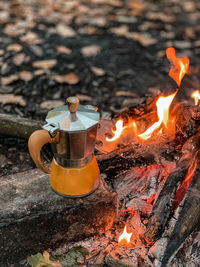 Small thing meters, fire, mokapot, coffee in forest.