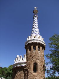 Low angle view of tower against clear blue sky