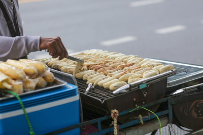 Grilled bananas are sold and prepared on the streets