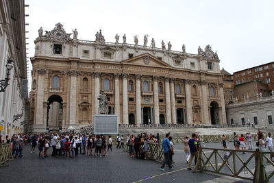 Group of people in front of historical building