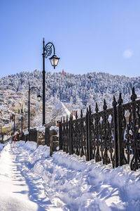 Snow covered field against sky shimla mall road