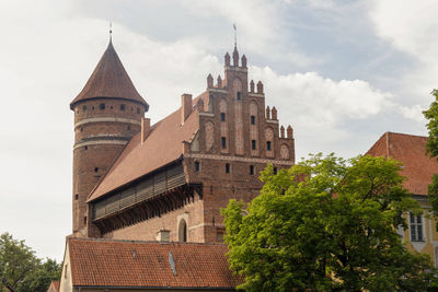 Low angle view of old building against sky