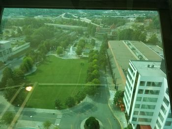 High angle view of buildings seen through glass window