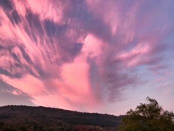 Low angle view of dramatic sky during sunset