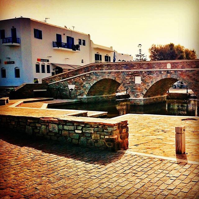 architecture, built structure, building exterior, house, residential building, residential structure, sky, arch, outdoors, canal, cobblestone, building, no people, railing, city, water, connection, day, town, clear sky