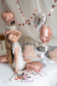 High angle view of young woman with bouquet