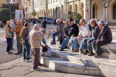 People on sidewalk in city