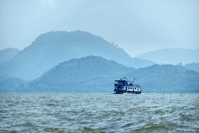 Scenic view of sea against mountain range