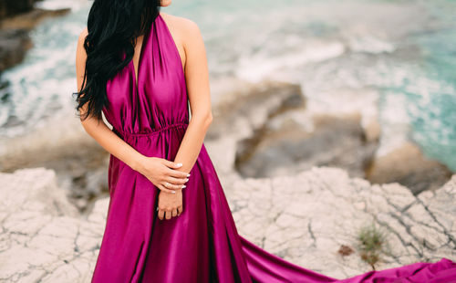 Rear view of woman standing outdoors