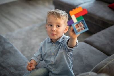 Portrait of boy playing with toy blocks