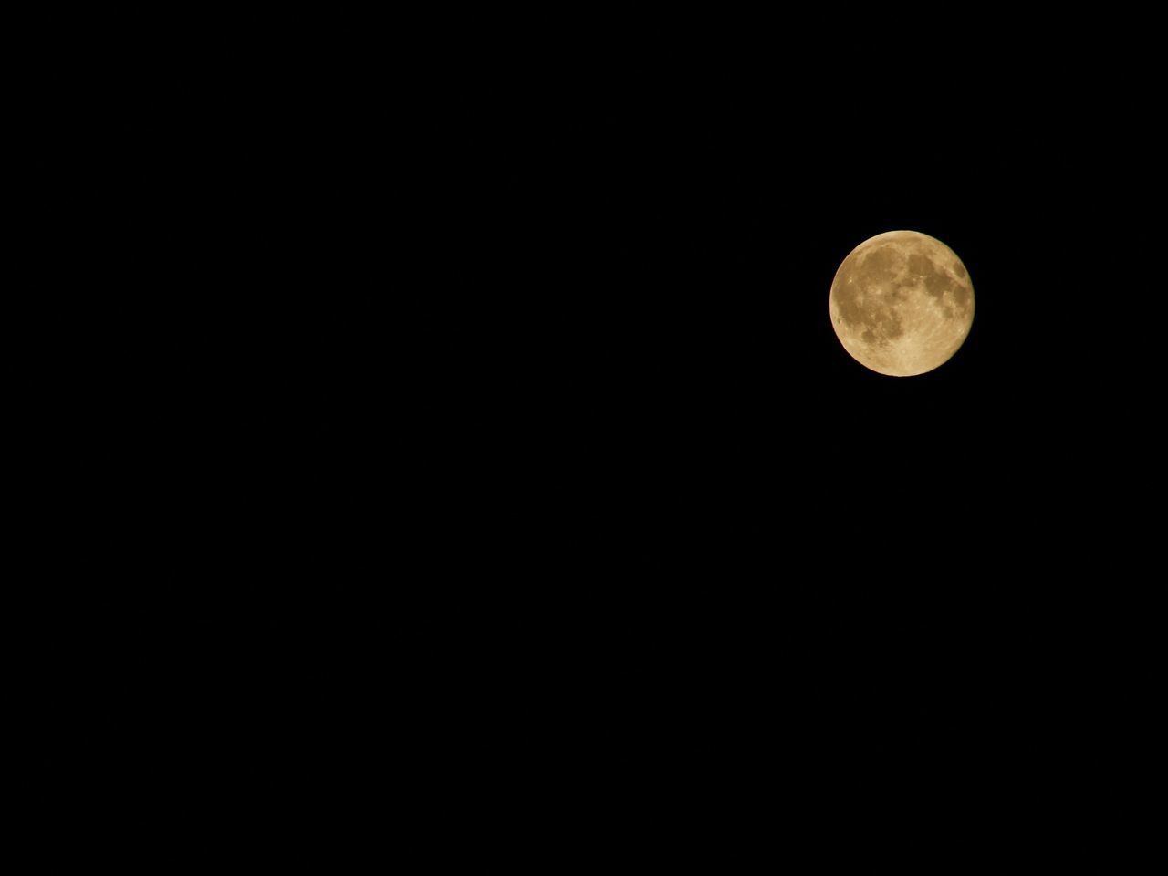 LOW ANGLE VIEW OF MOON AGAINST CLEAR SKY