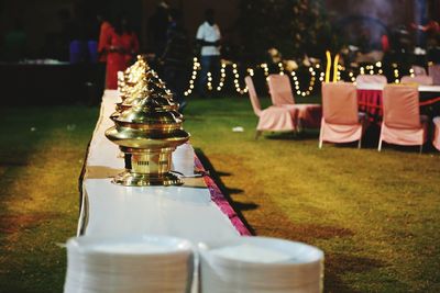 Close-up of chess pieces on table in park