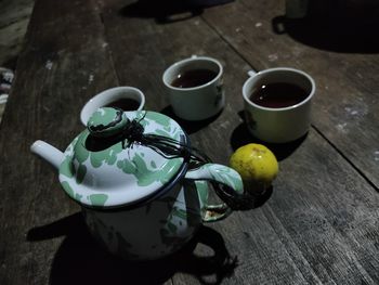 High angle view of coffee cups on table