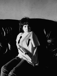 Full length of a boy sitting indoors