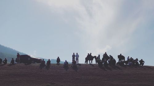 People on field against sky