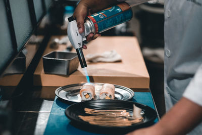 Midsection of person preparing food