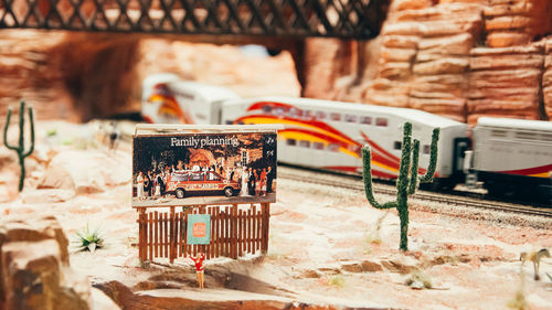 Close-up of abandoned objects on table against wall