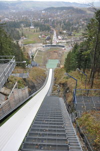 High angle view of steps amidst buildings in city