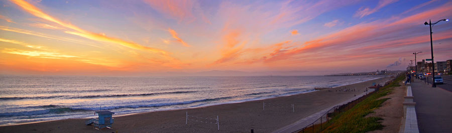 Scenic view of beach at sunset