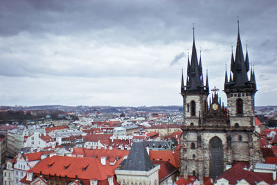 High angle view of church against cloudy sky