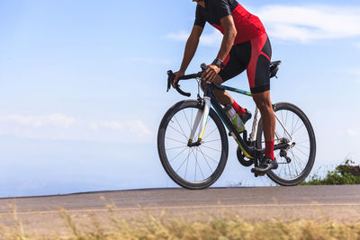 Low angle view of man riding bicycle