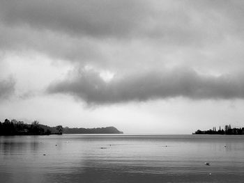 Scenic view of sea against storm clouds