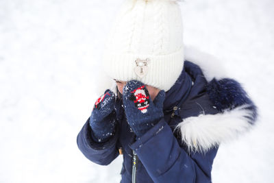 Midsection of person wearing hat during winter