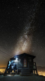 Built structure against sky at night