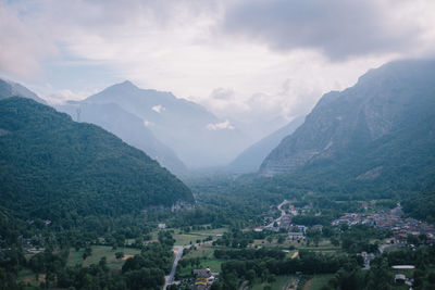 High angle view of townscape and mountains against sky