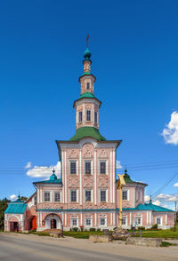 Low angle view of building against blue sky