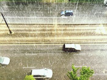 High angle view o cars on road during rainy season