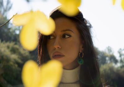 Close-up of young woman looking away