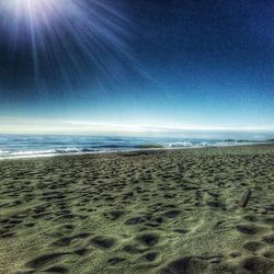 Scenic view of beach against sky