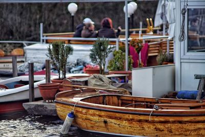 People in boat at winter