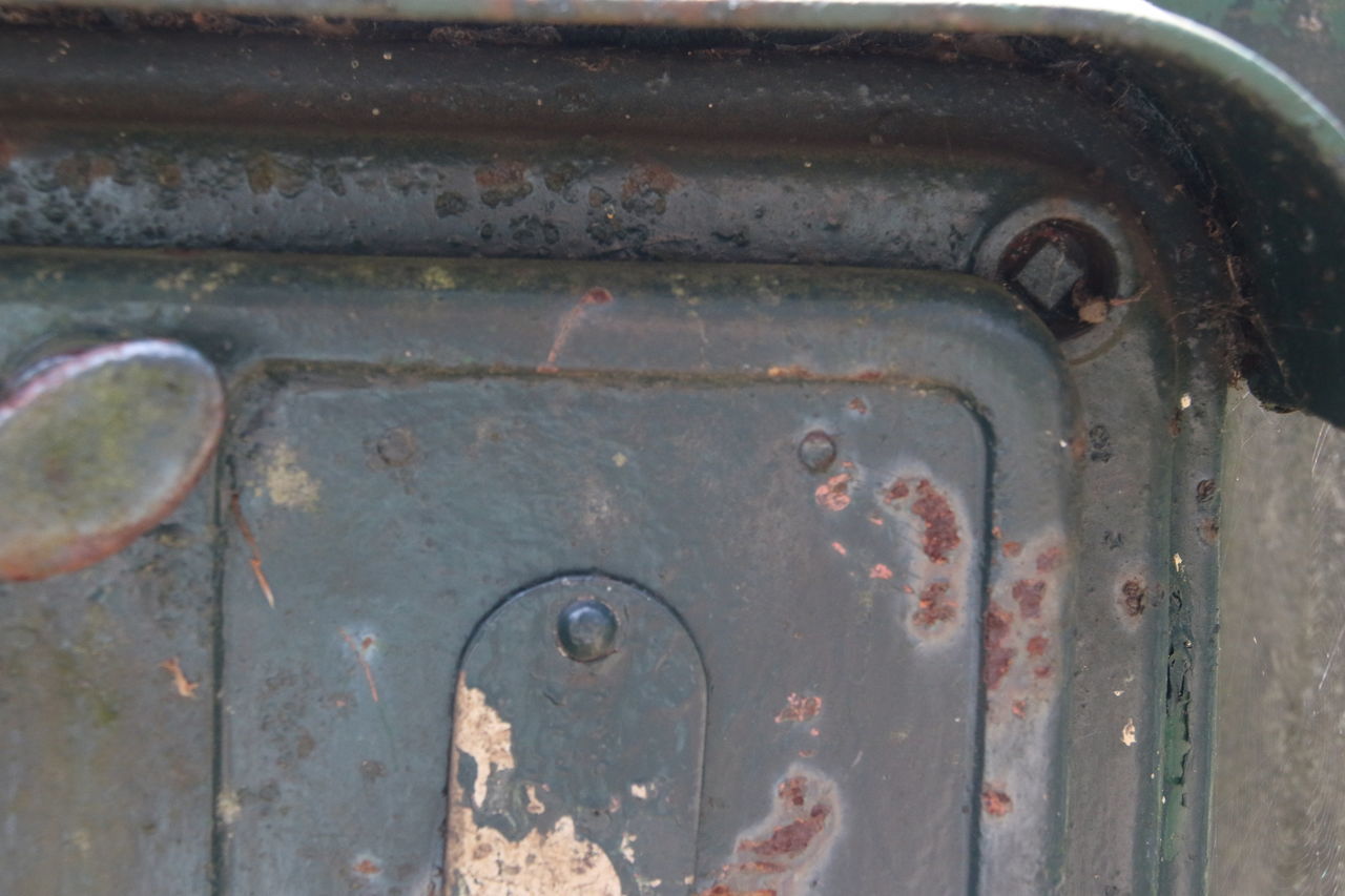 CLOSE-UP OF OLD RUSTY METAL DOOR