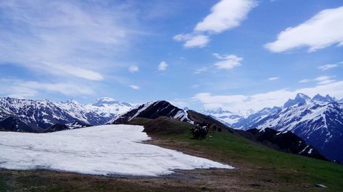 Scenic view of snowcapped mountains against sky