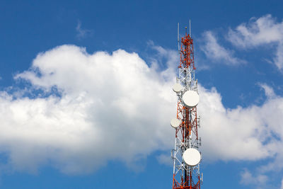 Low angle view of communications tower against sky