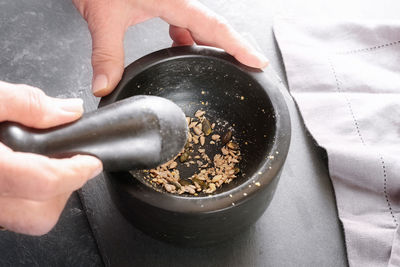 Cropped hand of person preparing food