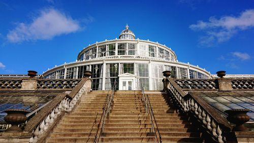 Low angle view of botanical building against sky