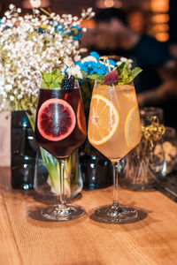 Close-up of wine glasses on table