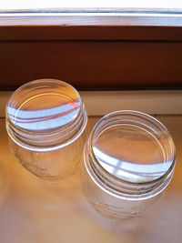 High angle view of glass jar on table