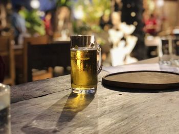 Close-up of beer glass on table