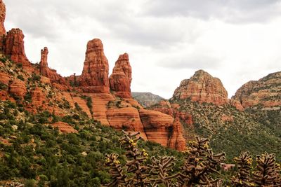 Scenic view of mountains against cloudy sky