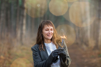 Portrait of smiling girl standing outdoors