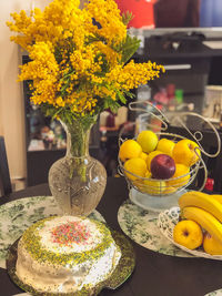 Close-up of yellow flowers on table