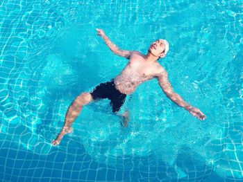 High angle view of man surfing in swimming pool